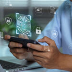 Hands holding a smartphone with digital lock and verification icons representing an age verification system